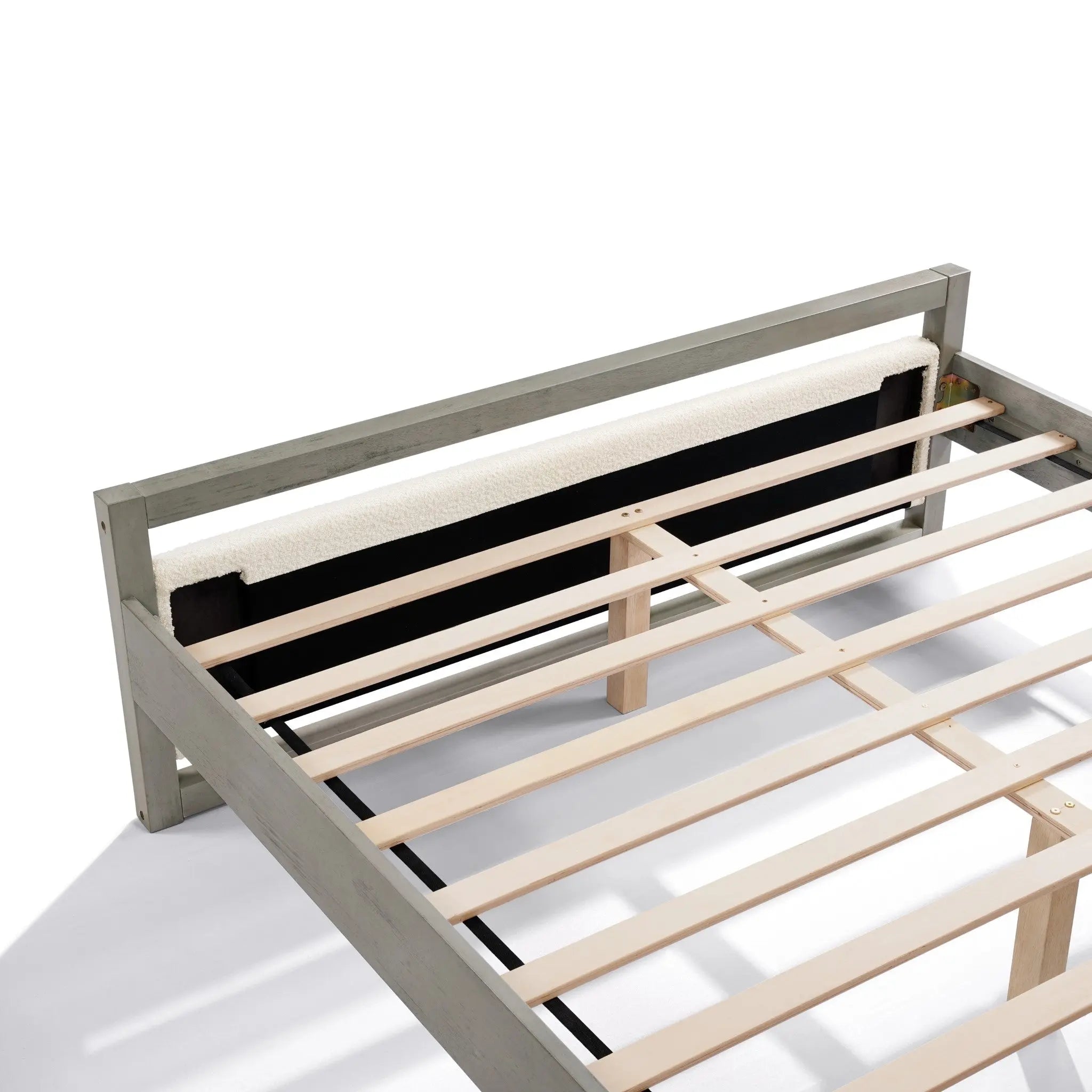Modern bedroom elegance meets functionality with this gray wooden bed frame, featuring a simple headboard design. The slats and support beam provide sturdy support against a white backdrop.