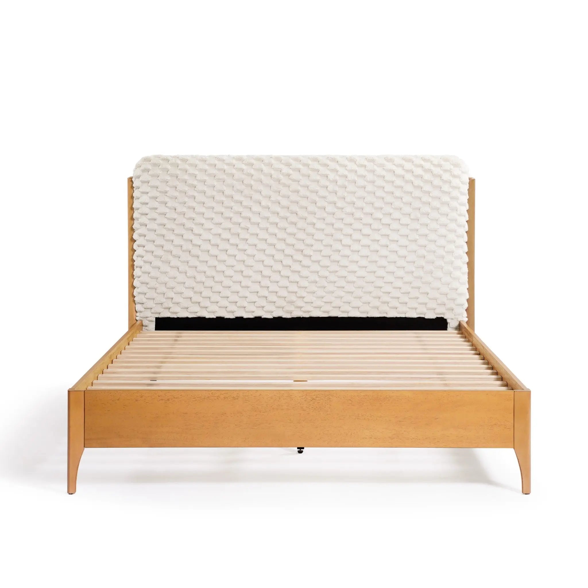 This Rubberwood Platform Bed features a contemporary visual dimension, boasting a wooden frame with an upholstered headboard and a slatted base, ready for your choice of mattress.