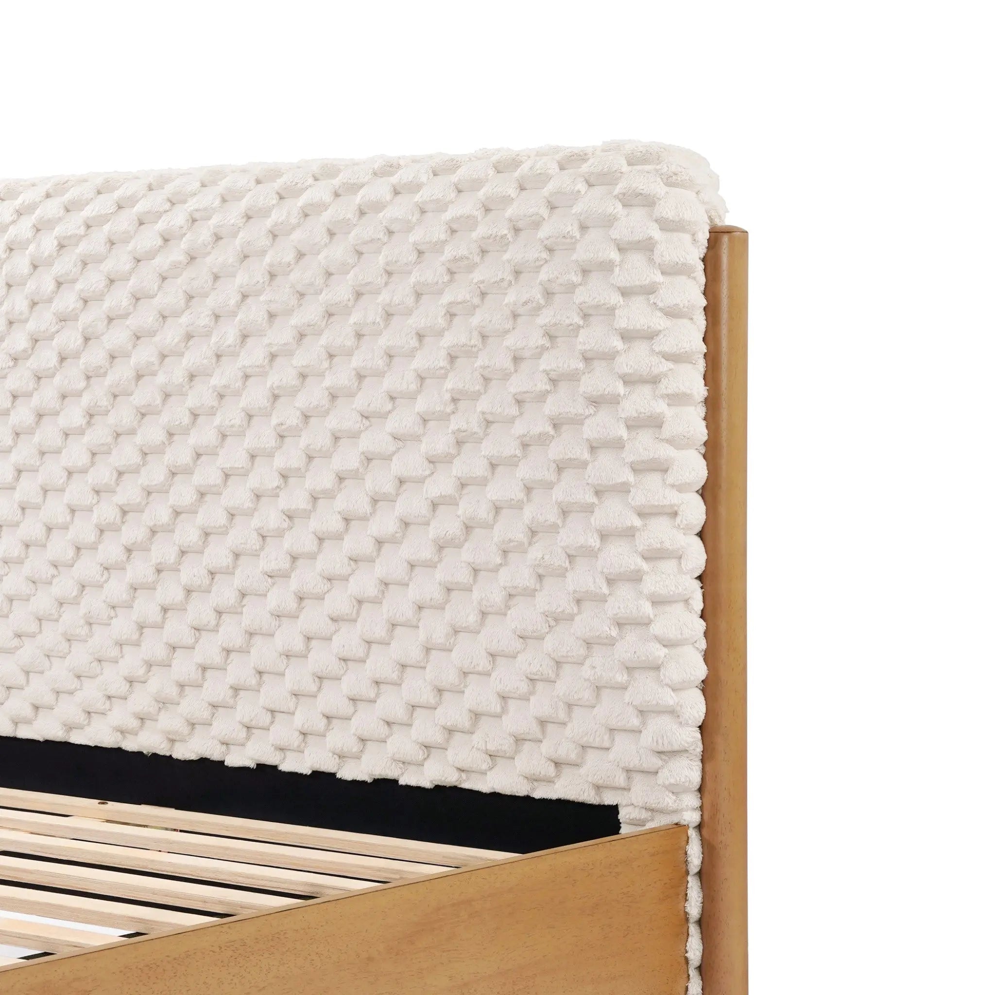 Upholstered headboard with a textured woven design adds contemporary visual dimension to the elegant rubberwood platform bed frame.