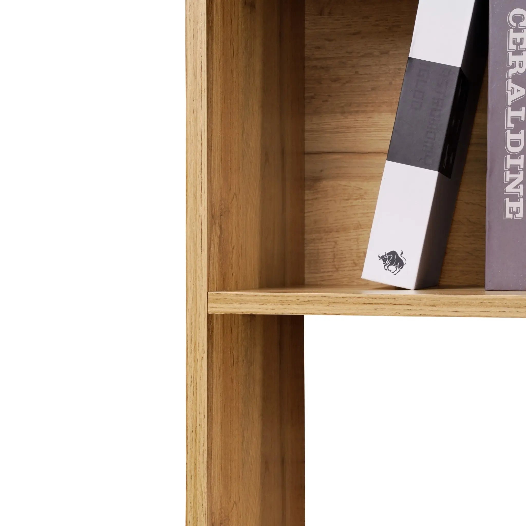 A corner of a modern-style bookshelf with a light walnut finish showcases two large books standing upright, partially visible, offering ample storage space.