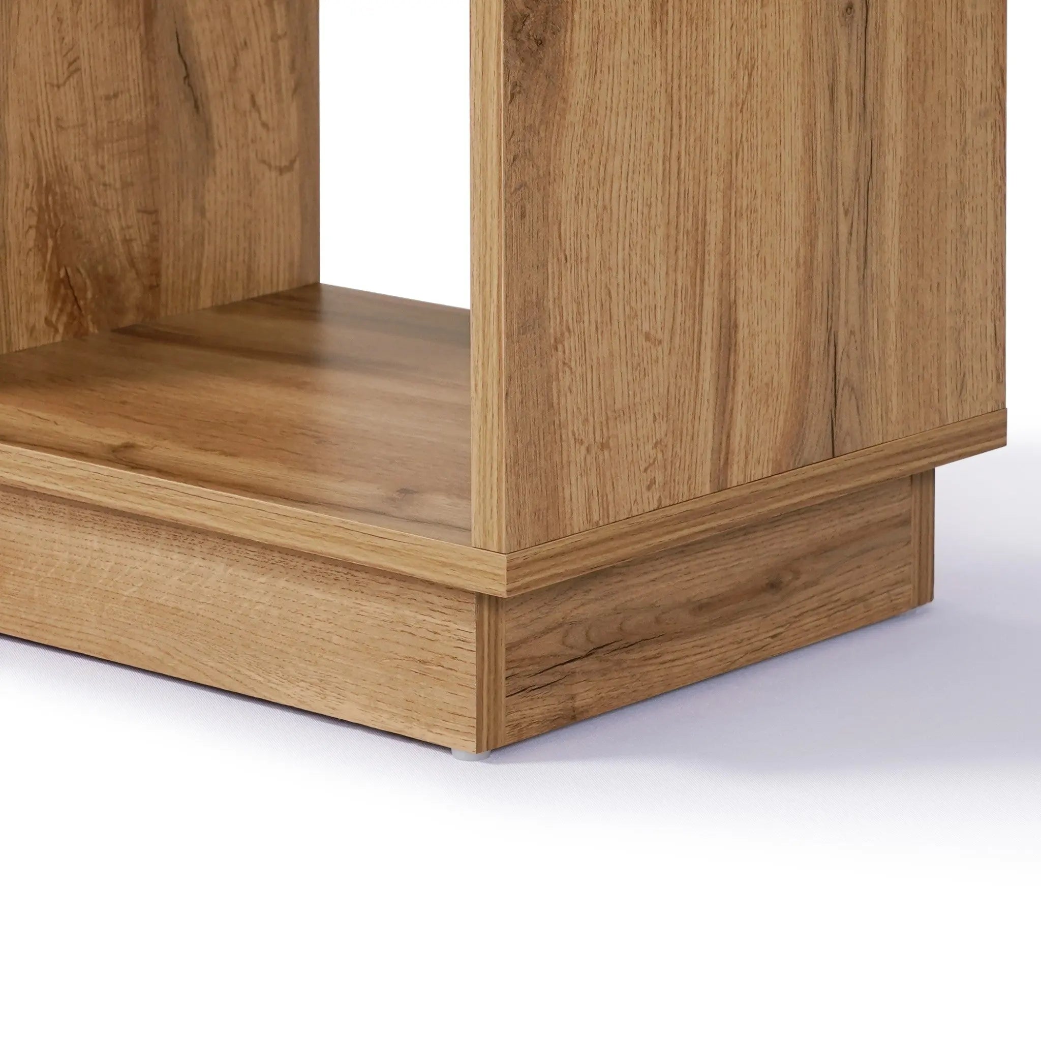Close-up of the lower corner of a wooden shelf with a light walnut finish, highlighting its wood grain texture and clean lines.