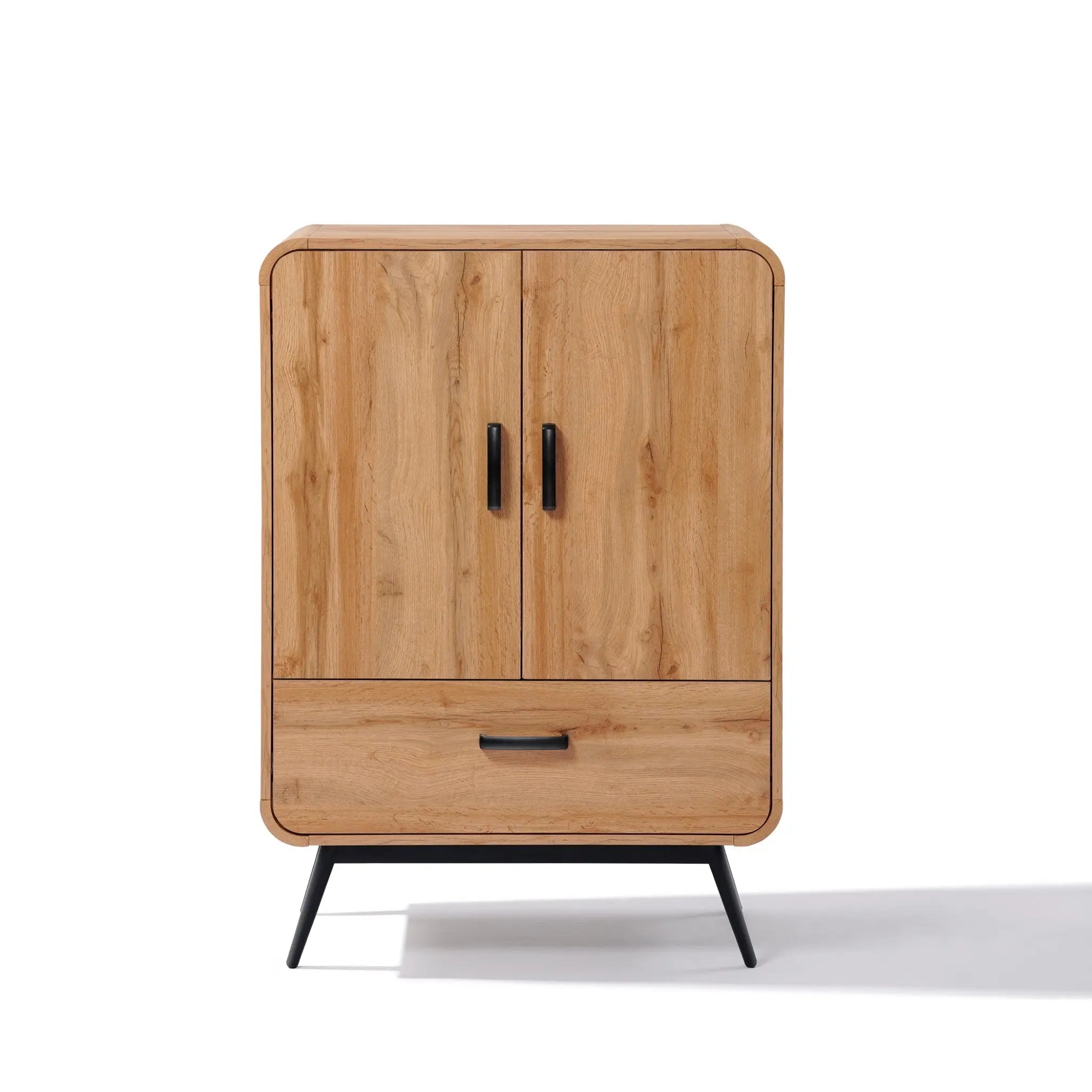 Walnut oak finish wooden cabinet with two doors and a lower drawer, featuring black metal handles and legs, embodies mid-century modernism.