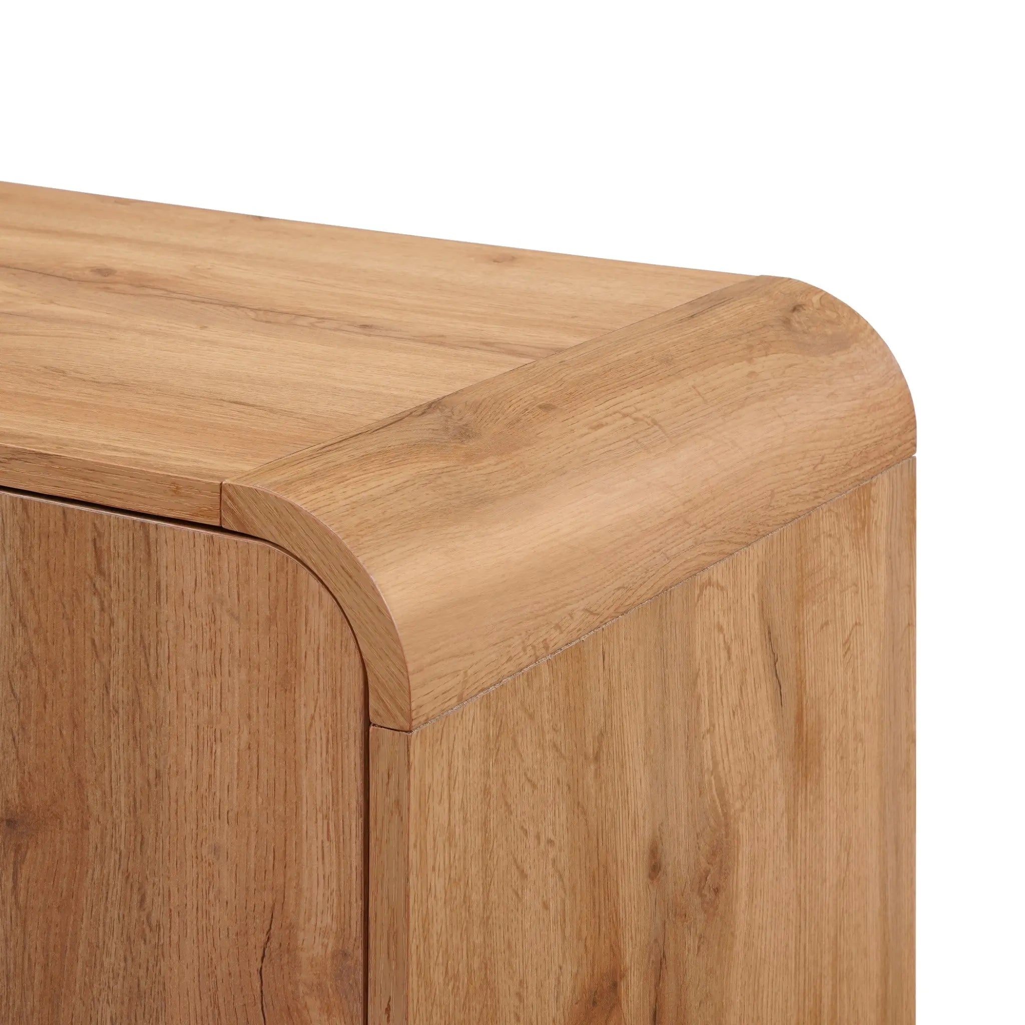 Close-up of a freestanding cabinet with a smooth corner showcasing a walnut oak finish and visible wood grain, exuding an air of mid-century modernism.