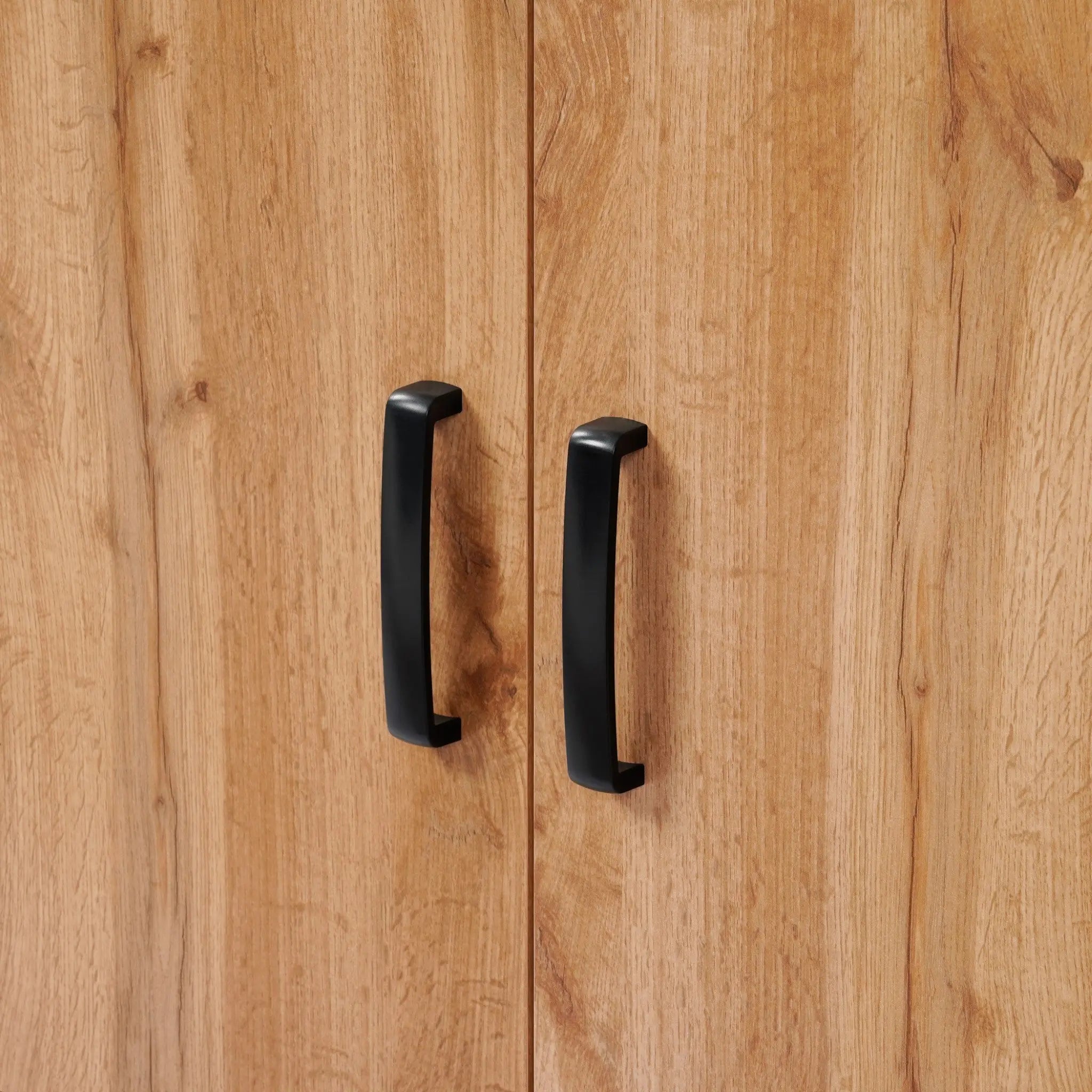 Close-up of two black handles on the Randolph wood accent sideboard by LuxenHome, featuring a modern walnut finish with light brown grain. The vertical handles are near the center seam of the cabinet doors, adding functionality and style to your storage space.
