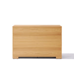 A plain, light wood 3-tier dresser with a minimalist design and smooth surface, set against a white background.