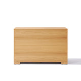 A plain, light wood 3-tier dresser with a minimalist design and smooth surface, set against a white background.