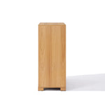 A wooden 4-drawer chest viewed from the side against a white background, perfectly blending style and functionality as a mid-century modern storage solution.