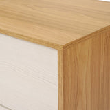 Close-up of a wooden cabinet corner, showcasing its light wood grain finish on the top and front surfaces, epitomizing mid-century modern design. This elegant piece doubles as an ideal storage solution with its sleek 4-drawer chest configuration.