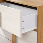 A mid-century modern design wooden dresser with an open drawer reveals a pristine white interior, offering both style and a practical storage solution.