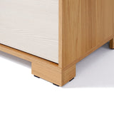 Close-up of a wooden furniture corner on a white background, showcasing light wood grain and a simple, minimalist design reminiscent of mid-century modern design.