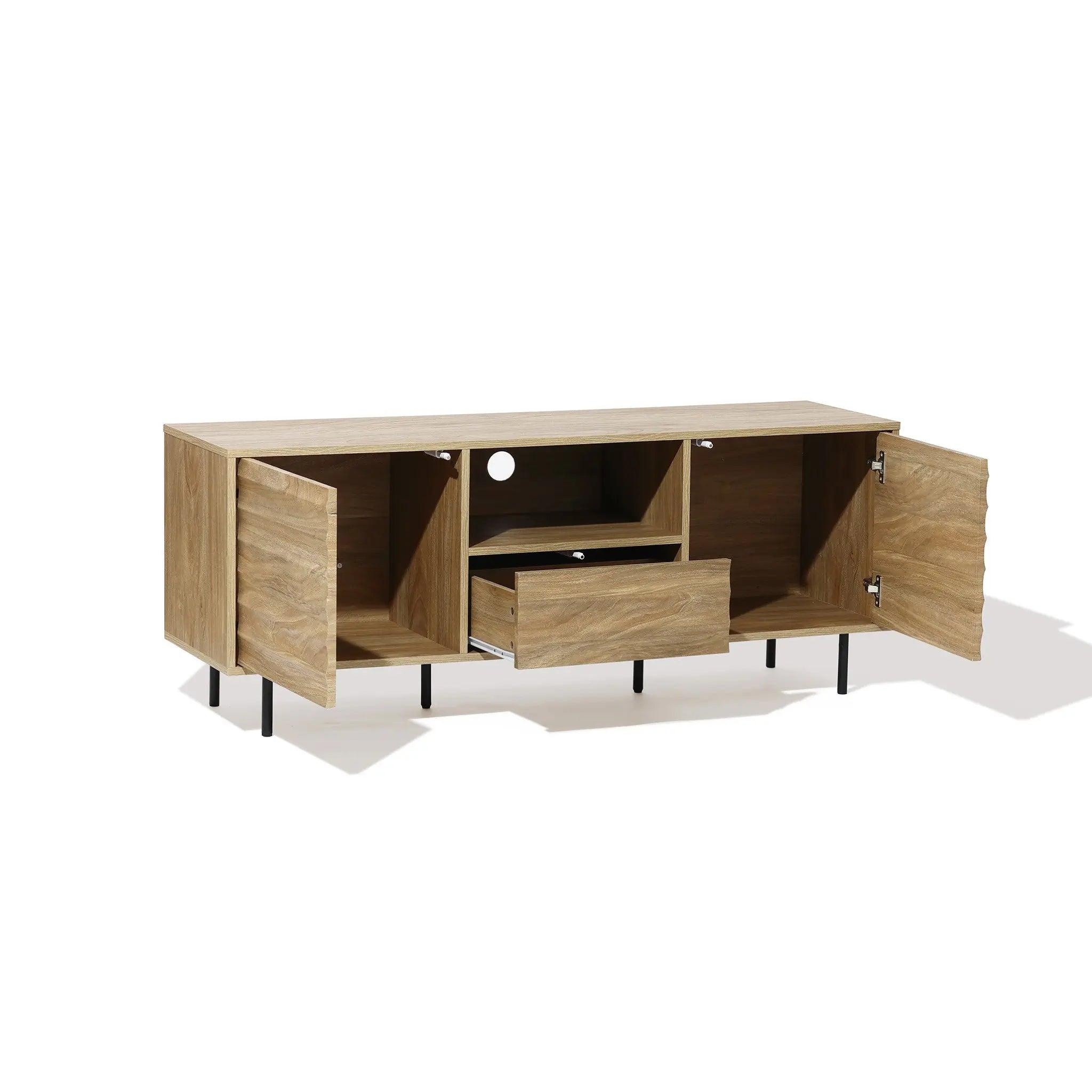 This mid-century modern wooden TV stand, crafted from light walnut-colored wood, features sleek black legs. It includes two open cabinets, a central drawer, and a convenient cable management hole for an organized setup.