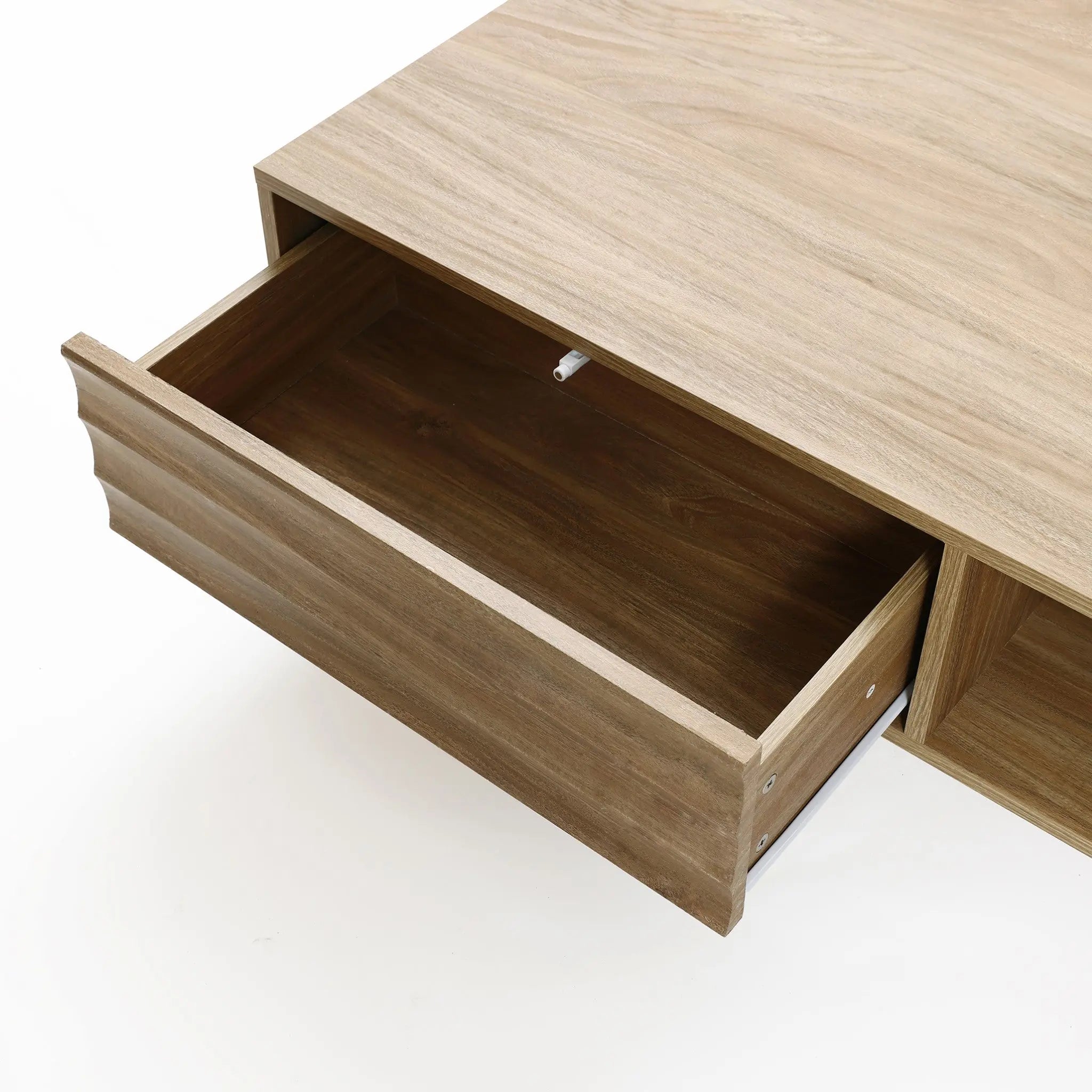 A wooden drawer partially open, revealing an empty interior, suggests hidden storage space. The drawer is part of a light wood piece of furniture with a mid-century modern design against a white background.
