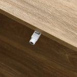A close-up of a wooden surface on a mid-century modern coffee table showcases a small white plastic latch neatly attached to the side.