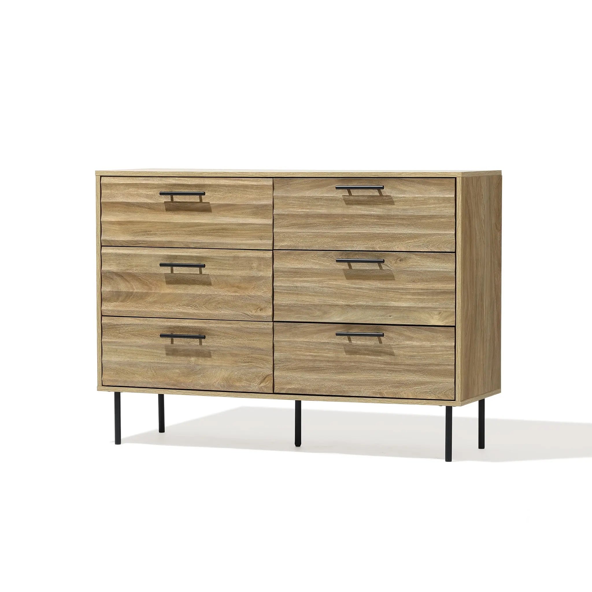 The LuxenHome Casper dresser is a mid-century modern piece with a brown wood grain, light finish, and sleek black metal handles. It features six drawers and slender black metal legs, exuding minimalist elegance against a plain white background.