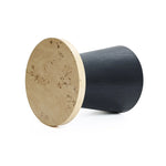 A modern, two-toned cylindrical stool with a tree burl texture lies on its side, showcasing a light, textured wooden top and a smooth, dark base. Perfect as a side table or seating option with lightweight MDF construction for easy mobility.