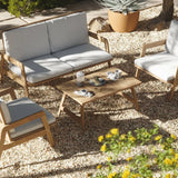 patio-set-with-a-coffee-table-two-chairs-and-a-couch