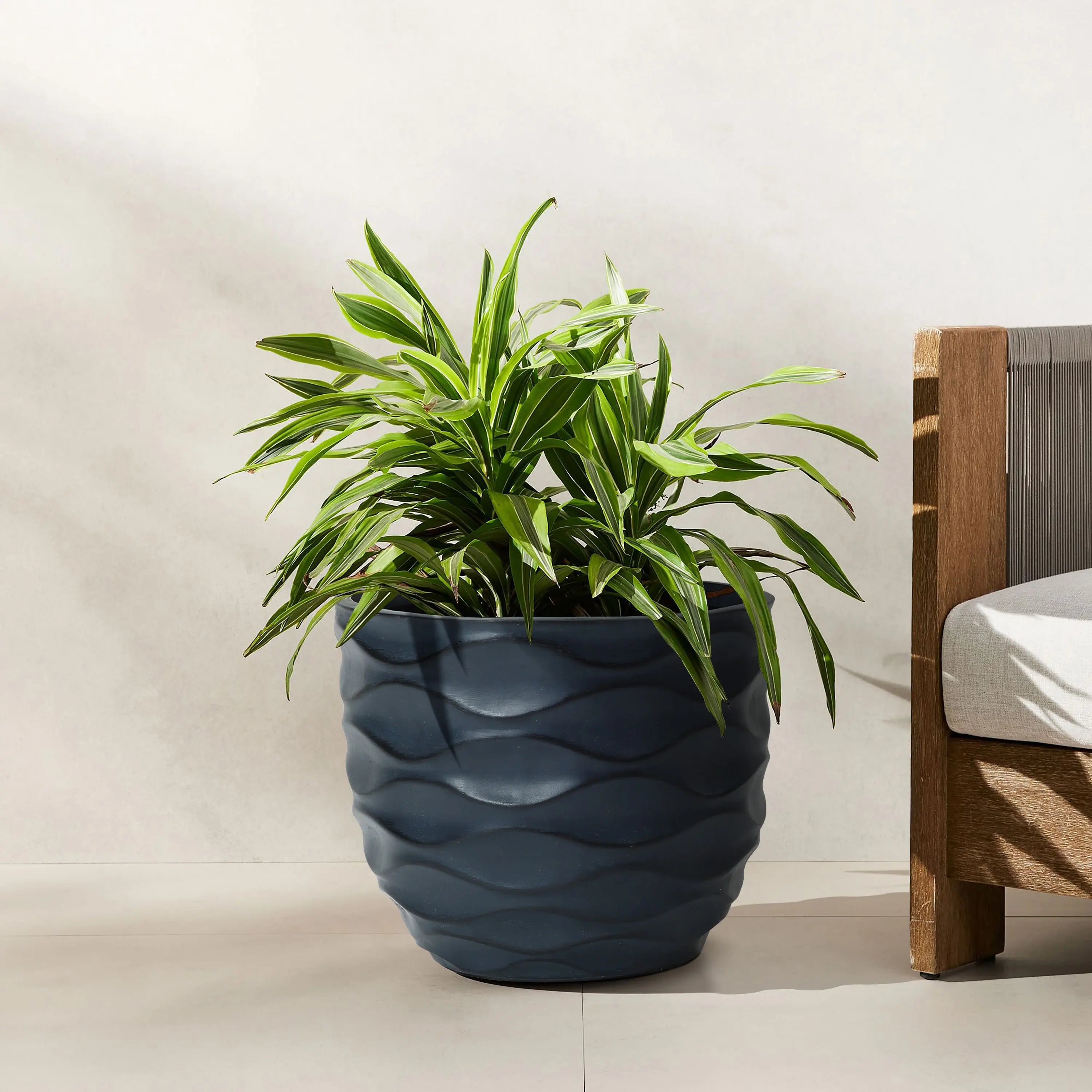 navy blue planter pot outdoor LuxenHome 13.4-Inch Round Black Waves MgO Planter