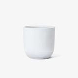 Contemporary planter in a minimalist design, featuring a plain white ceramic pot on a white background.