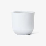A contemporary, white ceramic planter featuring a minimalist design with a rounded base set against a white background.