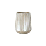 A magnesium oxide planter in beige, featuring vertical white stripes and a tapered top, blends both elegance and durability.