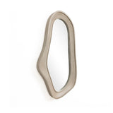 Oval irregularly shaped wall mirror with a natural finish wood frame, beautifully mounted on a white wall, perfect for modern home decor.
