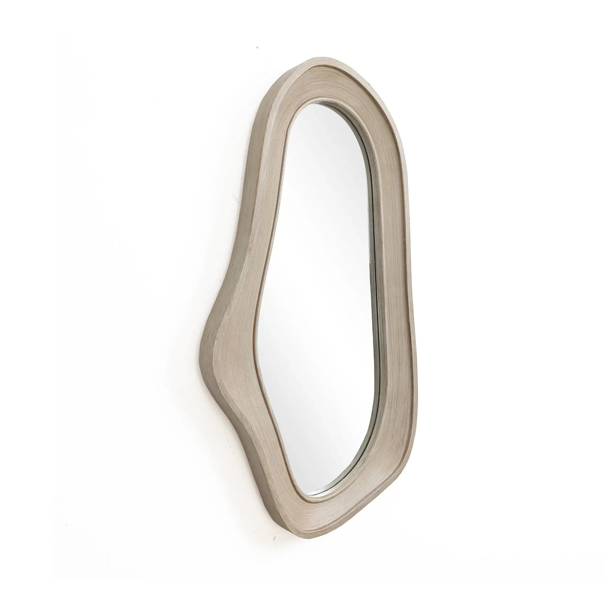 Oval irregularly shaped wall mirror with a natural finish wood frame, beautifully mounted on a white wall, perfect for modern home decor.