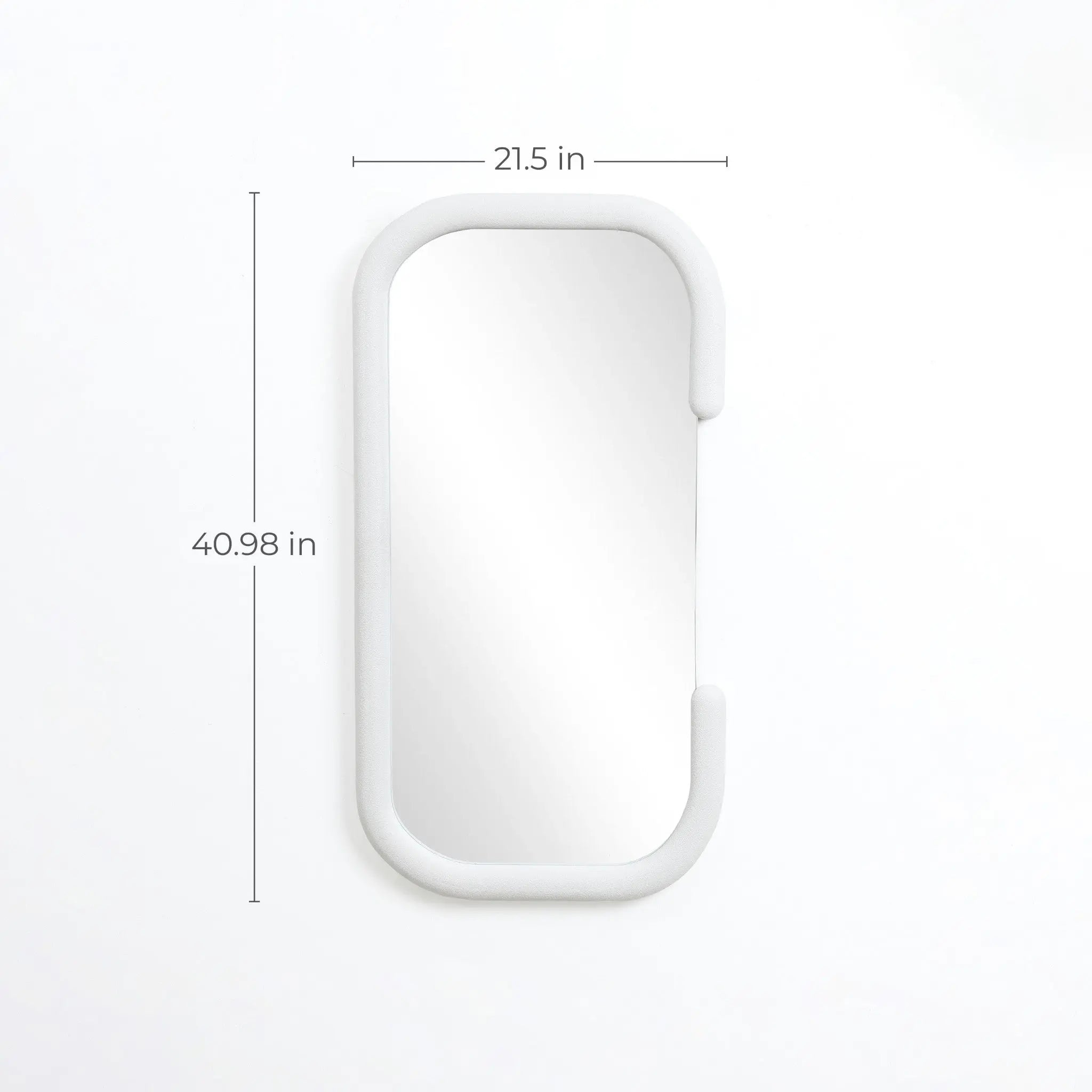 This decorative wall mirror showcases modernist elegance with its vertical rounded rectangular design and crisp white frame. Its dimensions, 40.98 inches tall and 21.5 inches wide, make it a striking addition to any space, enhancing your décor seamlessly against a clean white background.