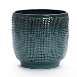 The Marina gray glazed round ceramic planter by LuxenHome is a textured, cylindrical item with a greenish-blue hue and grid pattern, shown against a white background. Measuring 11.22 high, it brings an artistic touch to your decor.