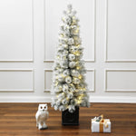 Snow-flocked-artificial-christmas-tree-with-led-lights-in-living-room