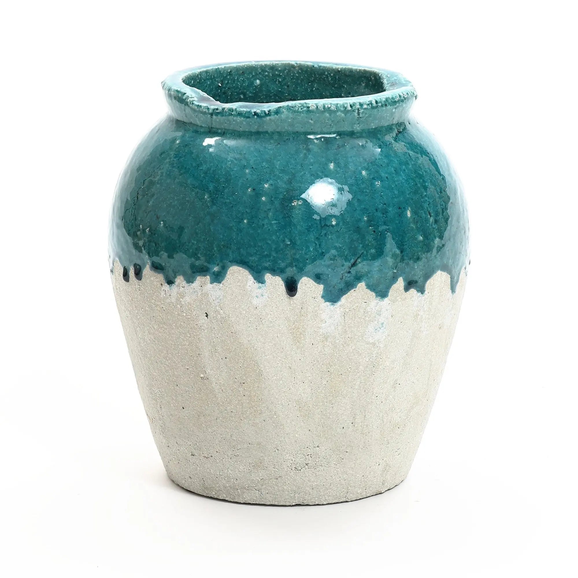 A ceramic vase with a glossy teal upper half and a textured white lower half, reminiscent of rustic design, featuring a slightly uneven rim, set against a plain white background.