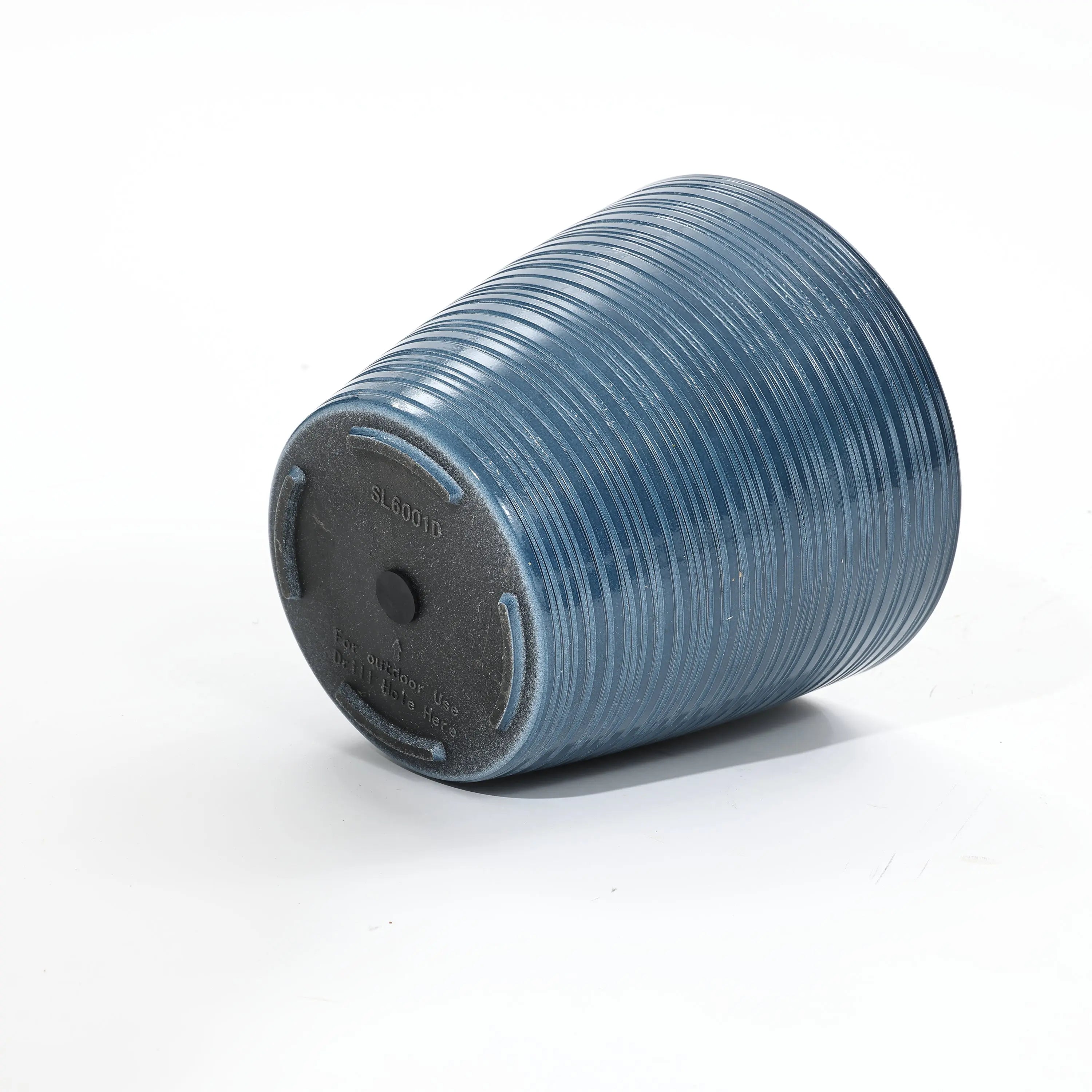 A blue, ribbed, upside-down plastic plant pot with raised text on the base sits on a white surface. Ideal for indoor and outdoor use, this decorative planter is designed with a UV-protected finish for lasting durability.