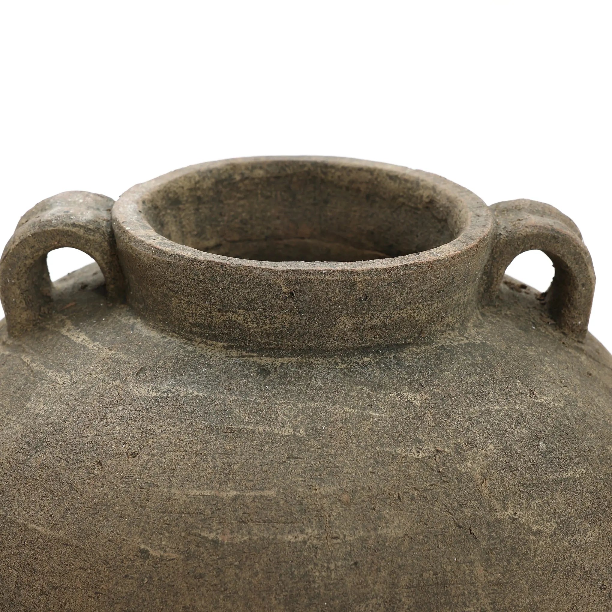 Close-up of LuxenHomes Rustic Brown Terracotta Cauldron Vase, 14.6 h. With its wide opening and two round handles, it exudes natural elegance through a rough texture and earthy tones, boasting age-old imperfections that add charm to any home decor.