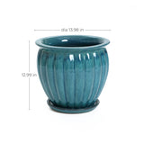 Navy blue ceramic decorative planter with vertical ridges, attached saucer, and drainage holes. Measuring 13.98 inches in diameter and 12.99 inches tall, this pot adds elegance to any space.
