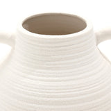 This close-up captures the rustic charm of a textured, white ceramic vase with two small handles near the top.
