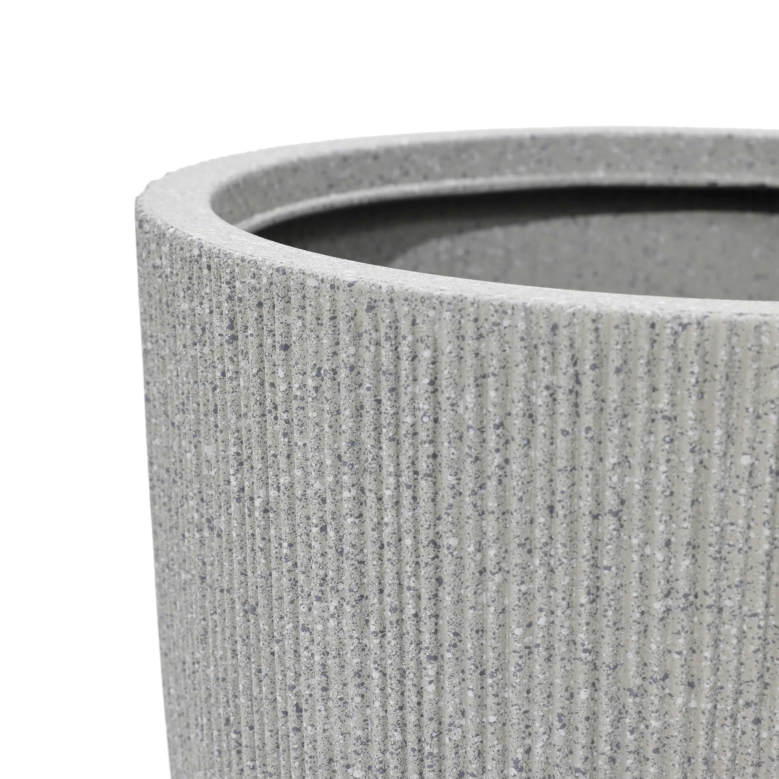 Close-up of a textured, gray cylindrical planter with a modern striped pattern and ribbed surface, showing the upper rim—a perfect addition to any home and garden.