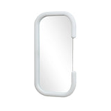 An oval mirror with a white padded frame, its C-shaped silhouette is slightly curved at the corners, embodying modernist elegance.