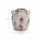 A weathered, gray stone vase with two handles, reminiscent of a terracotta jug vase, measures 11.8 inches tall and 10.4 inches in diameter. The piece boasts a handcrafted charm and vintage appeal that adds timeless elegance to any space.