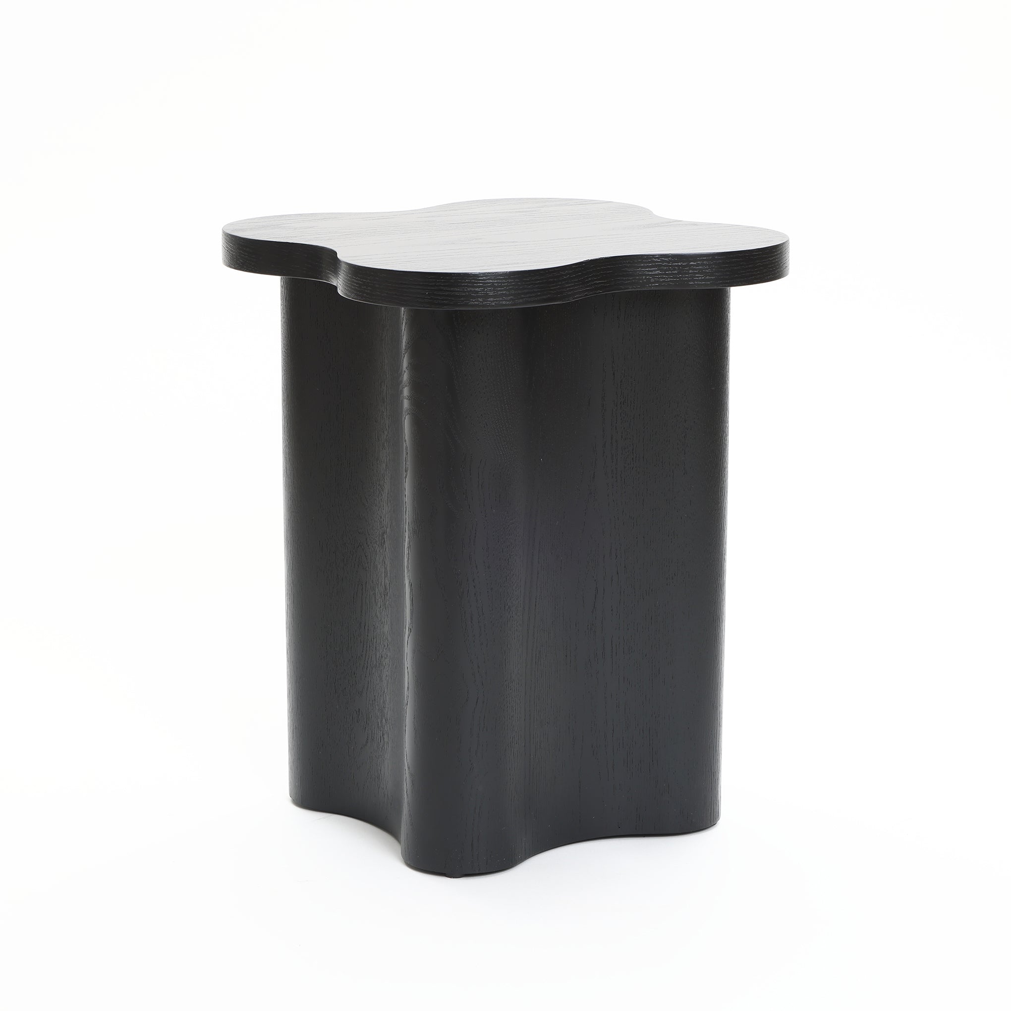 A modern-style side table featuring a black cloverleaf shape, crafted from premium MDF wood with four curved legs, set against a white background.