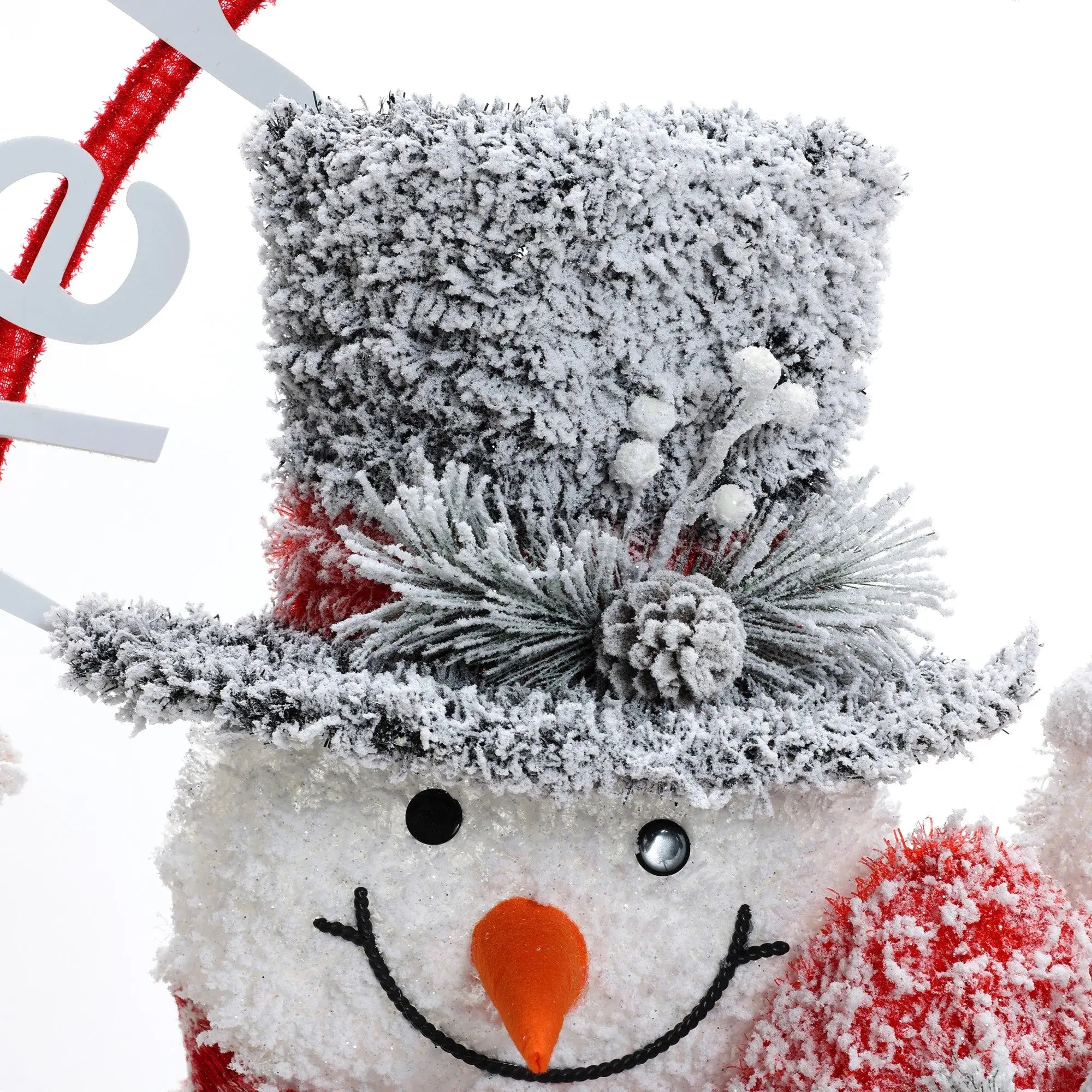 family-of-three-snowmen-is-adorned-with-red-striped-scarves-and-charming-hats
