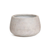 A speckled off-white planter crafted from high-quality MgO features a textured ceramic design with horizontal lines and a wide opening, set against a plain white background.