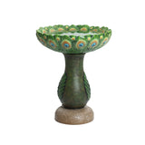 The Peacock Resin Birdbath features an exquisite design of green and brown with a peacock feather motif on the bowl and base. This stunning piece stands proudly in any outdoor space, resting elegantly on a textured round pedestal.