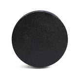 A black textured foam roller with a modern minimalist design stands upright against a white background, showcasing its unique white irregular pattern.
