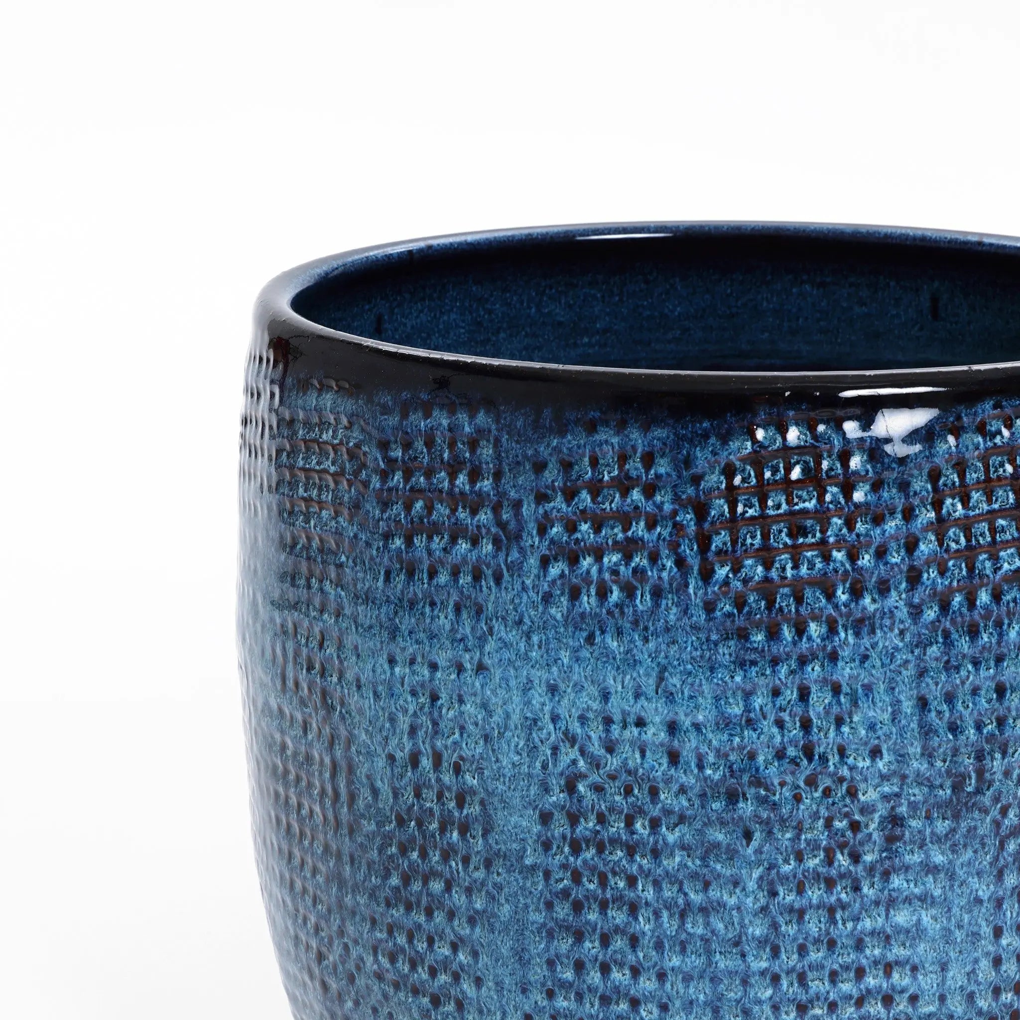 A close-up of LuxenHomes Ocean blue glazed round ceramic planter, standing 11.22 tall, reveals its dappled pattern and glossy finish with a stunning gradient color against a plain white background.