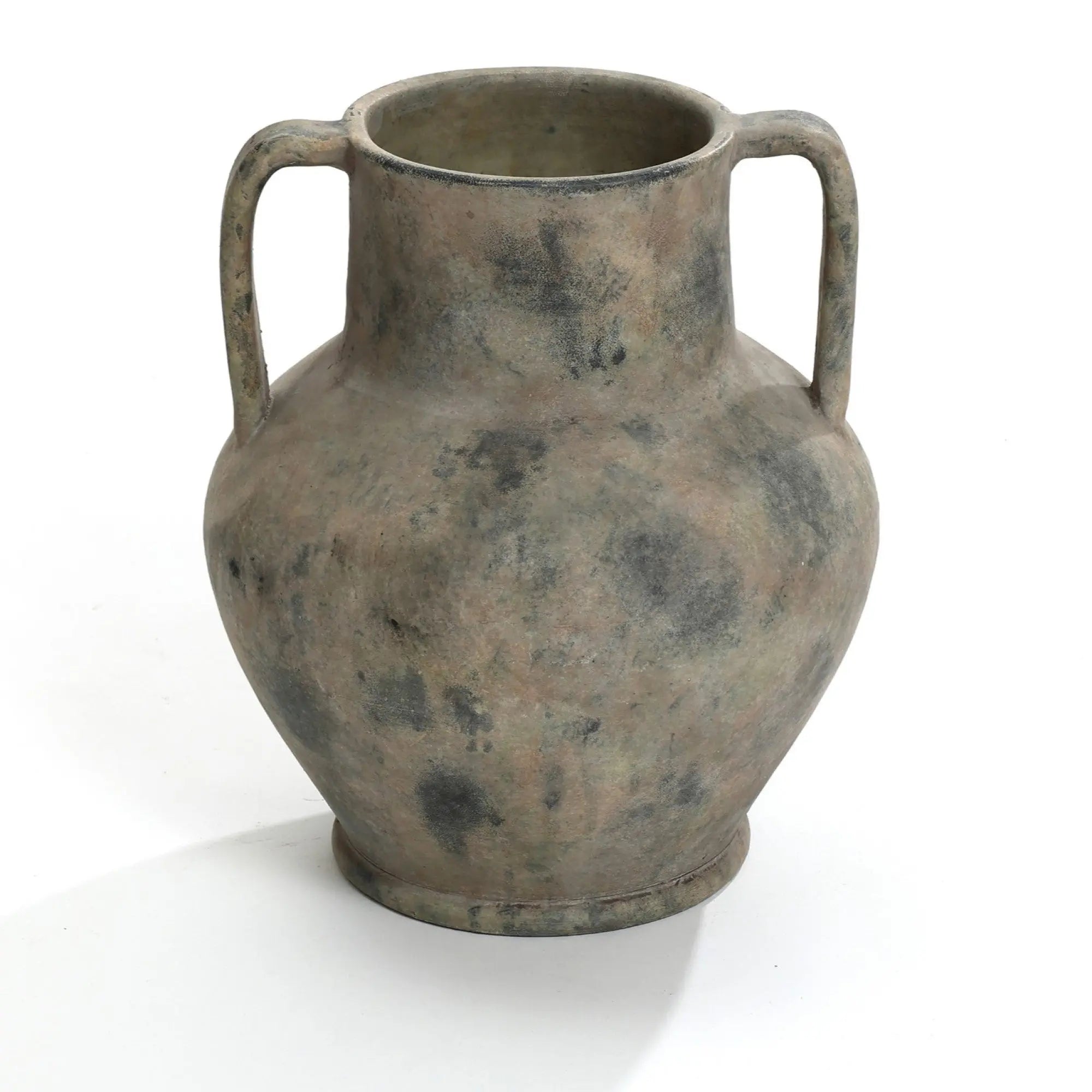 A Rustic mottled grey terracotta urn vase with handles by LuxenHome, measuring 12.1 high, sits on a plain white background. Its weathered surface features darker spots and rustic design elements, suggesting antiquity and historical value.