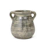Rustic ceramic pot with two handles, featuring a weathered, grayish finish that exudes historic depth.