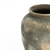 This 13.6 h Rustic Gold and Brown Terracotta Urn Vase from LuxenHome features a wide, rounded body and a slightly flared rim with an antique-distressed surface, displaying patches of darker and lighter shades that enhance its rustic charm for any home decor.