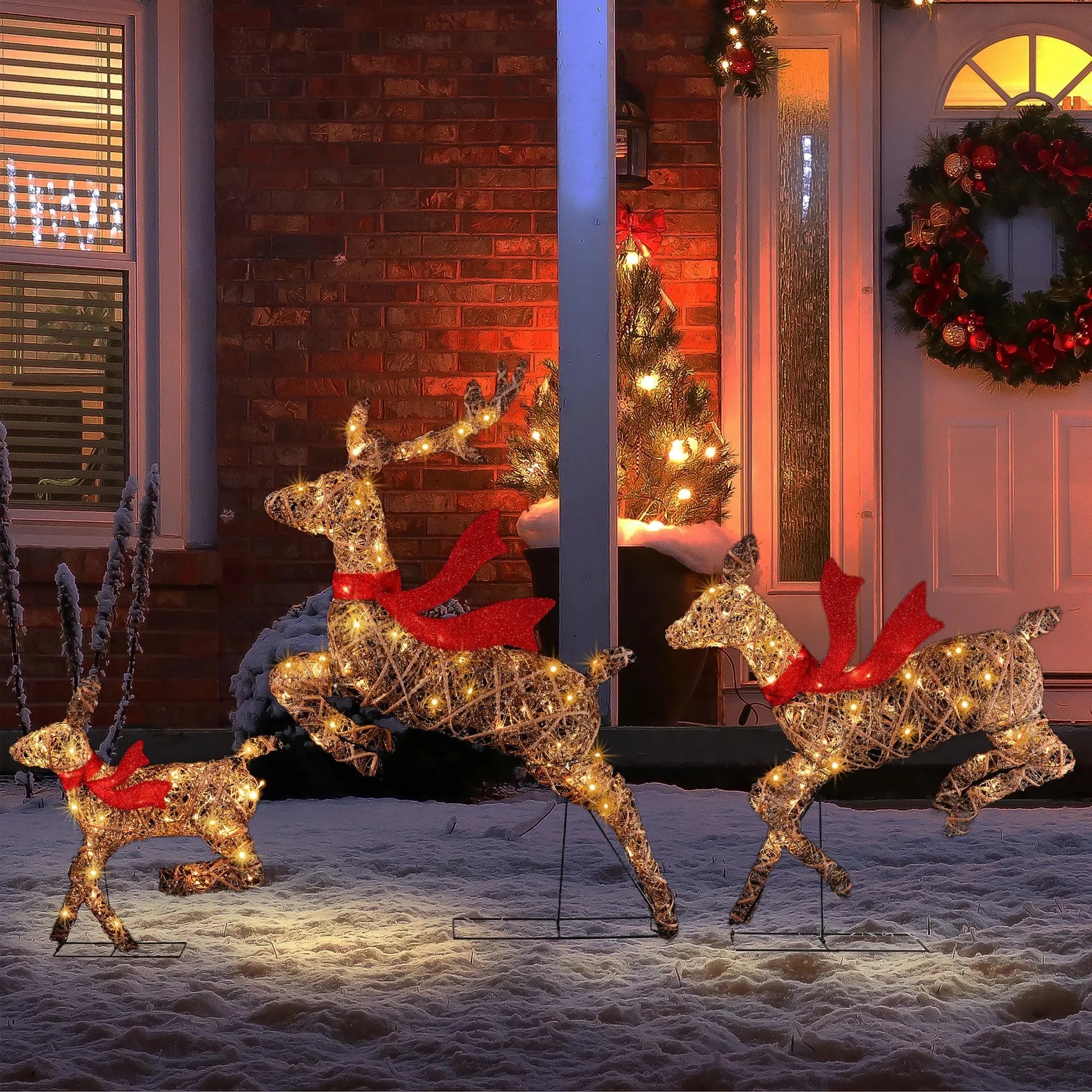 Lighted-running-reindeer-with-red-bows-Christmas-decorations