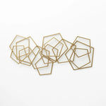 A cluster of overlapping gold geometric frames, crafted from iron, forms a stunning piece of metal wall art on a pristine white background.