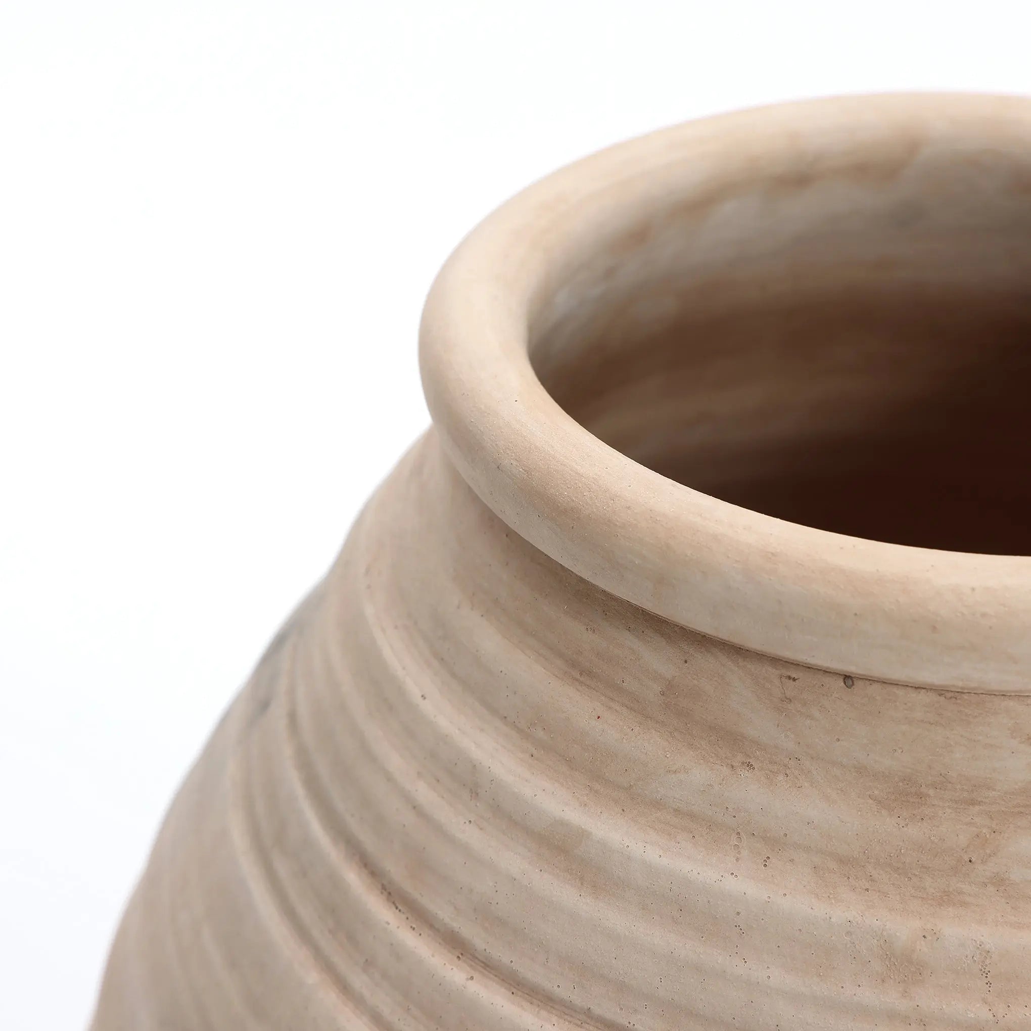Close-up of LuxenHomes Rustic beige ribbed terracotta urn vase, 13.2 h. It features a smooth rim and ribbed texture in a natural light brown, highlighting its handcrafted design against a plain white background.