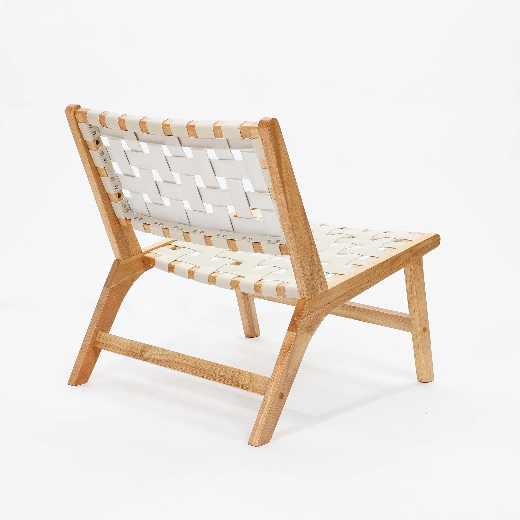 An accent chair crafted from solid wood frames, featuring a striking woven white strap back and seat design, viewed from the rear angle.